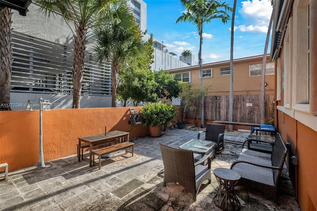 view of patio featuring fence