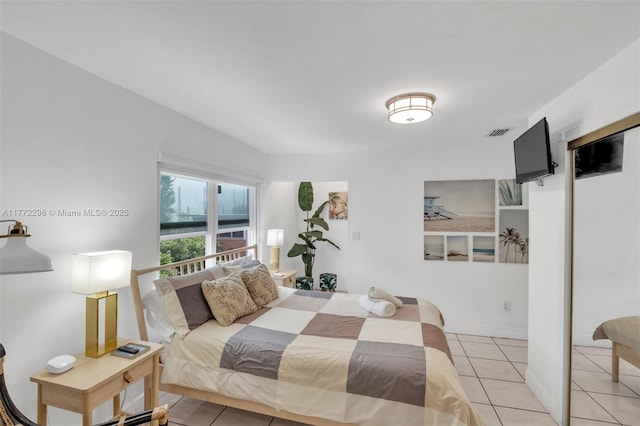 bedroom featuring visible vents and light tile patterned floors