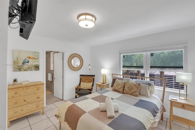 bedroom with light tile patterned floors