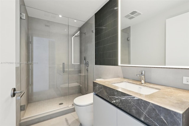 full bath with toilet, visible vents, recessed lighting, a shower stall, and vanity