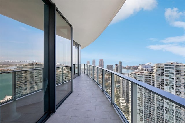 balcony with a city view and a water view