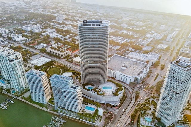 drone / aerial view with a city view and a water view