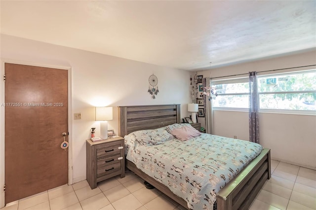 bedroom featuring light tile patterned floors