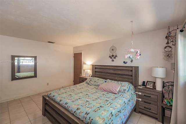bedroom with light tile patterned flooring and visible vents