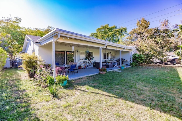 back of house with a patio, fence, and a yard