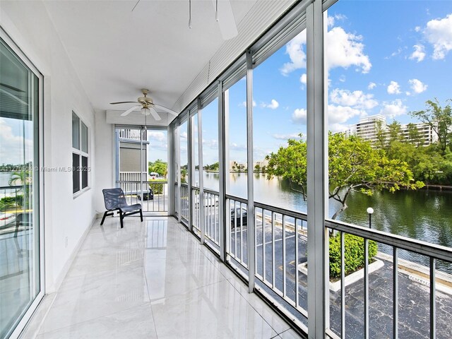 300 Diplomat Pkwy Unit 204, Hallandale Beach, FL 33009 - sunroom / solarium featuring a water view and ceiling fan