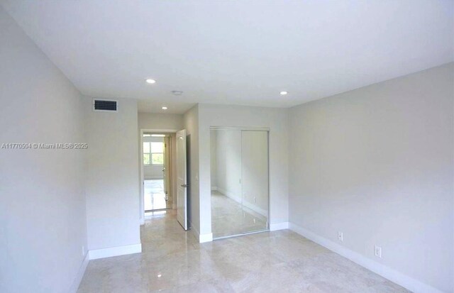 300 Diplomat Pkwy Unit 204, Hallandale Beach, FL 33009 - unfurnished bedroom featuring baseboards, visible vents, a closet, and recessed lighting