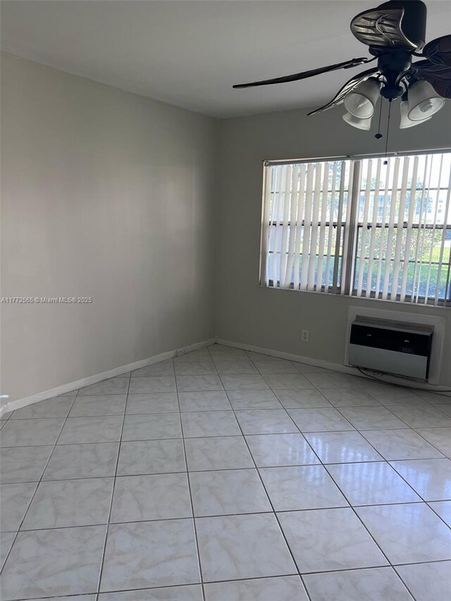 90 Fanshaw C Unit 90, Boca Raton, FL 33434 - tiled empty room with heating unit, a ceiling fan, a wall mounted AC, and baseboards