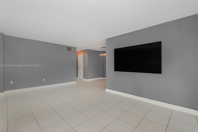 1030 9th St Unit 203, Miami Beach, FL 33139 - spare room with light tile patterned flooring and a chandelier