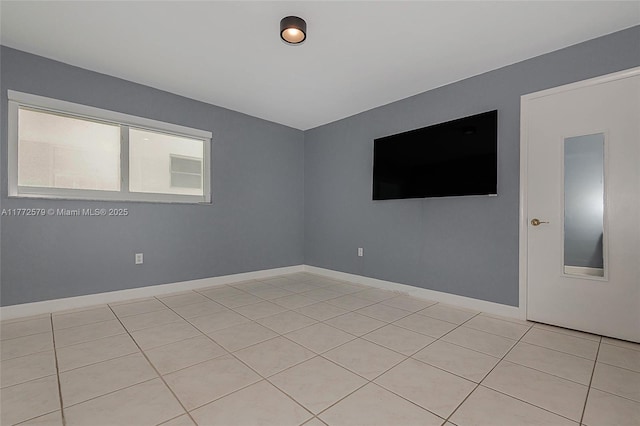1030 9th St Unit 203, Miami Beach, FL 33139 - empty room with light tile patterned flooring and baseboards