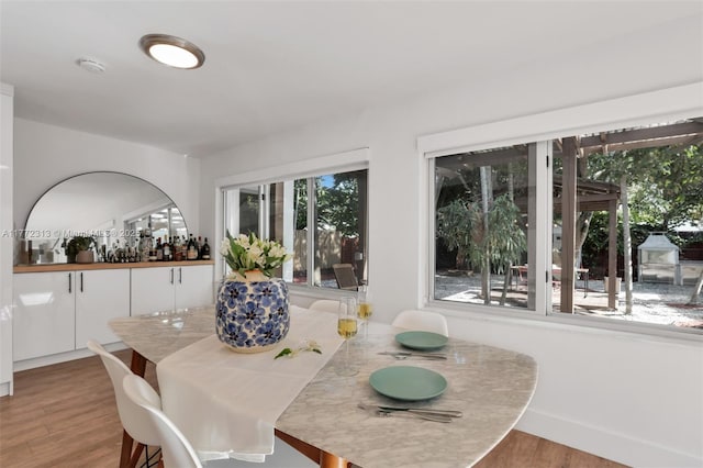 dining room featuring baseboards and wood finished floors