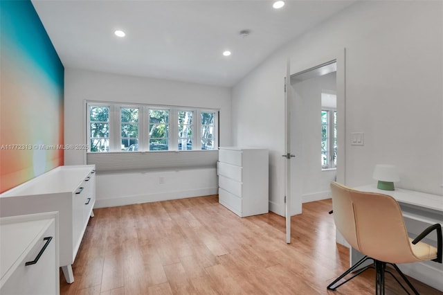 office space with light wood-style flooring, recessed lighting, and a healthy amount of sunlight