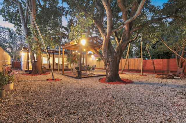 view of yard featuring fence and a patio