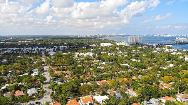 drone / aerial view with a city view and a water view