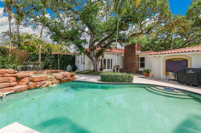 view of pool with a fenced in pool and a patio area