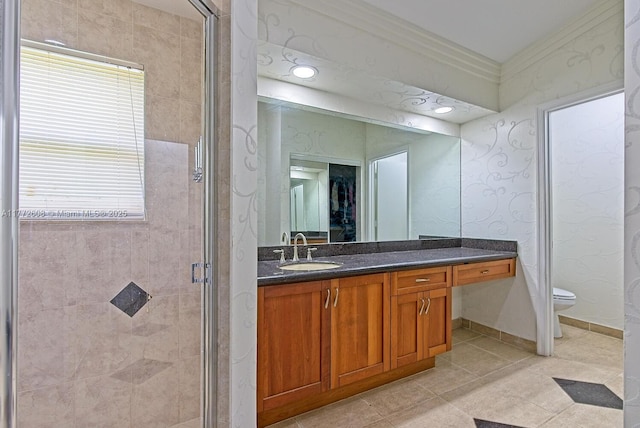full bathroom with toilet, vanity, a shower stall, tile patterned flooring, and baseboards
