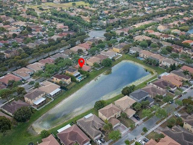 aerial view with a residential view and a water view