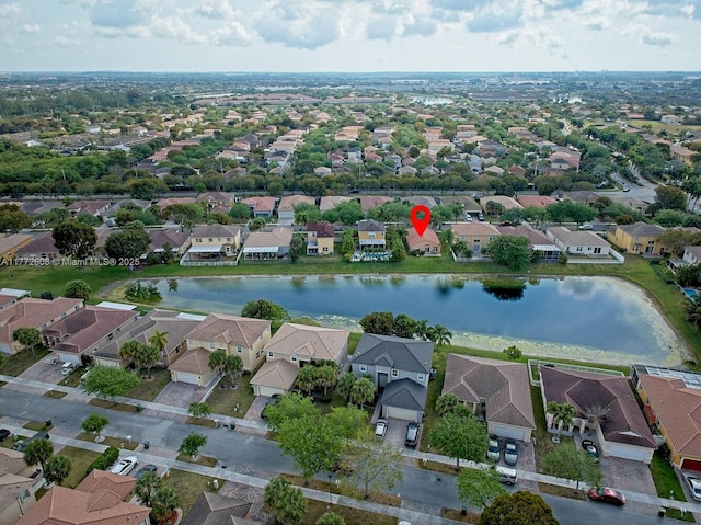 bird's eye view featuring a residential view and a water view