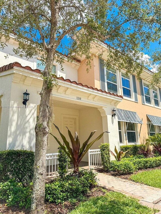 3210 NW 126th Ave Unit 3210, Sunrise, FL 33323 - view of front of property featuring a tile roof and stucco siding