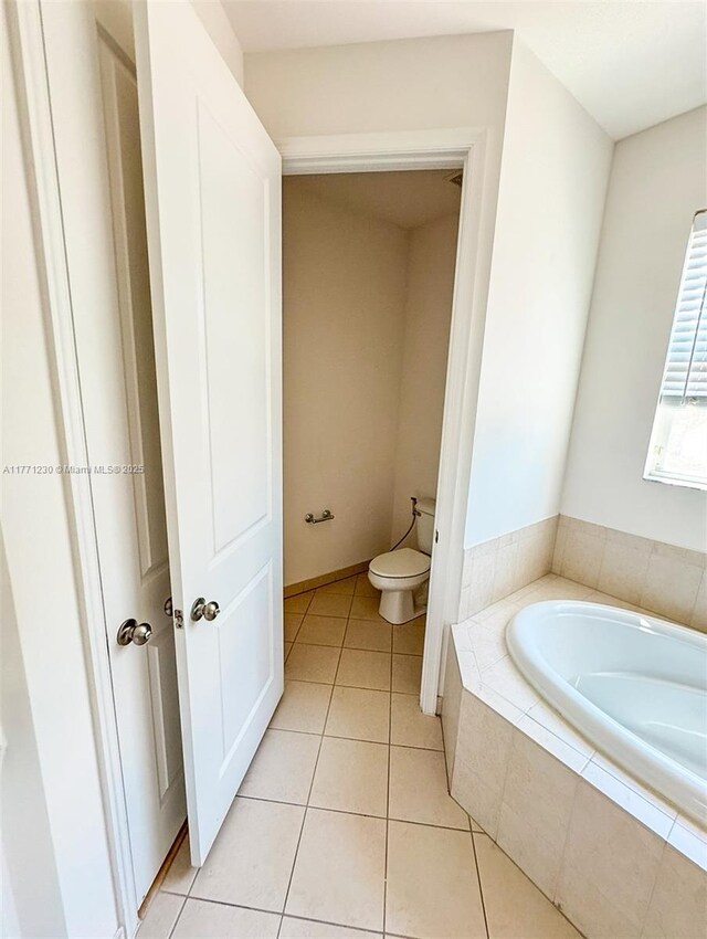 3210 NW 126th Ave Unit 3210, Sunrise, FL 33323 - full bathroom with a bath, toilet, and tile patterned flooring