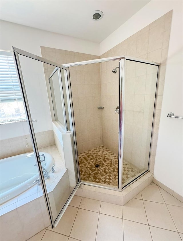 3210 NW 126th Ave Unit 3210, Sunrise, FL 33323 - bathroom with a stall shower, a bath, and tile patterned floors
