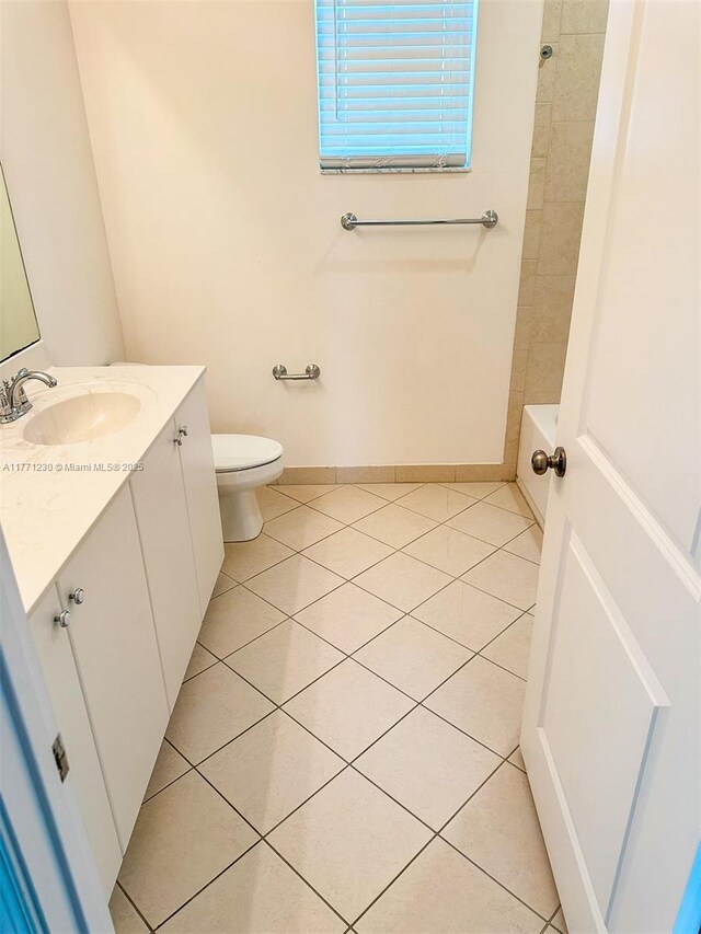 3210 NW 126th Ave Unit 3210, Sunrise, FL 33323 - full bathroom with tile patterned flooring, vanity, toilet, and baseboards