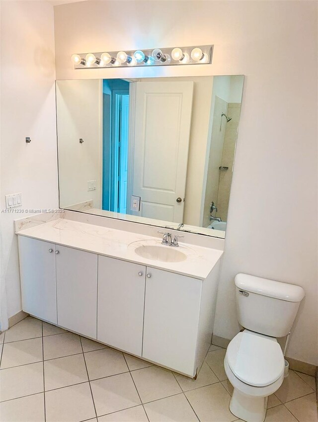 3210 NW 126th Ave Unit 3210, Sunrise, FL 33323 - full bath featuring a shower, vanity, tile patterned flooring, toilet, and baseboards