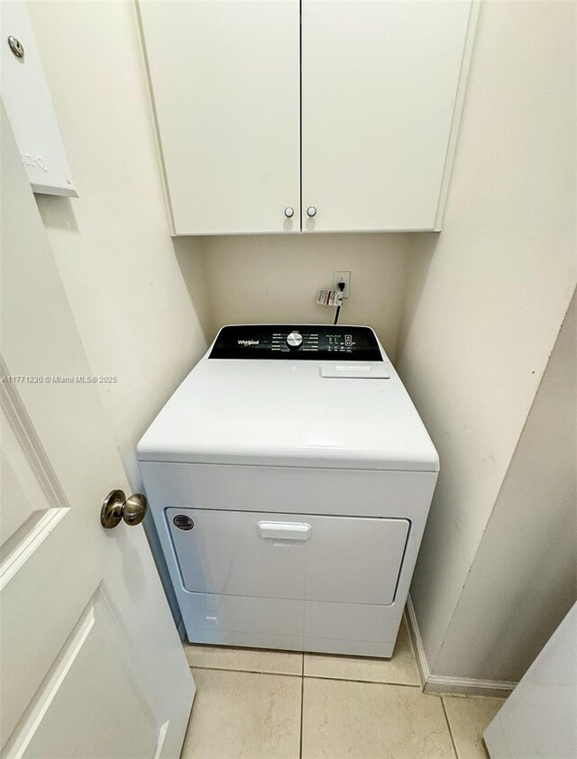 3210 NW 126th Ave Unit 3210, Sunrise, FL 33323 - laundry room featuring washer / dryer and light tile patterned floors