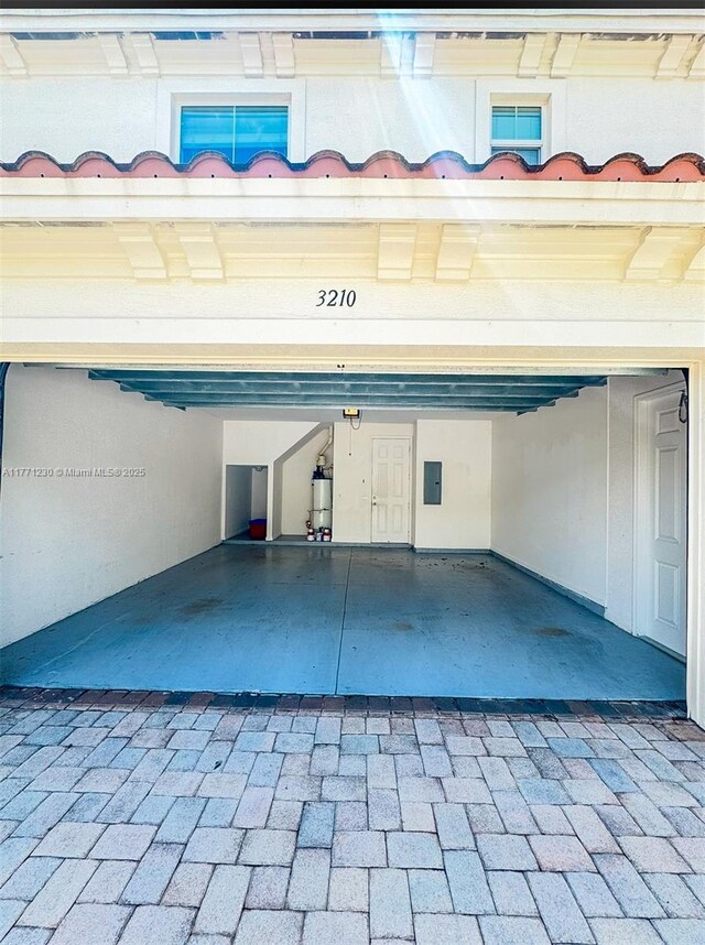 3210 NW 126th Ave Unit 3210, Sunrise, FL 33323 - garage featuring electric panel and water heater