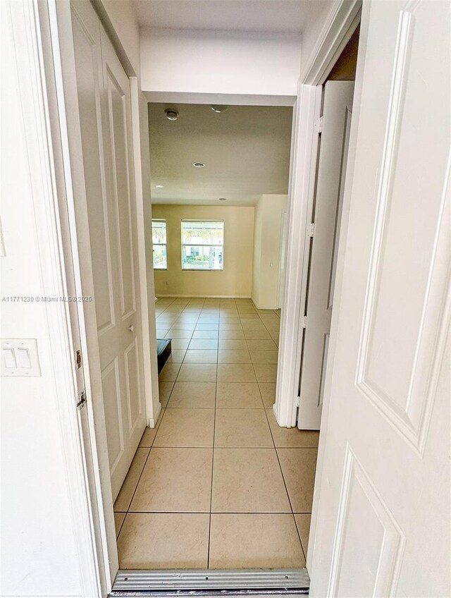 3210 NW 126th Ave Unit 3210, Sunrise, FL 33323 - corridor featuring light tile patterned floors and recessed lighting