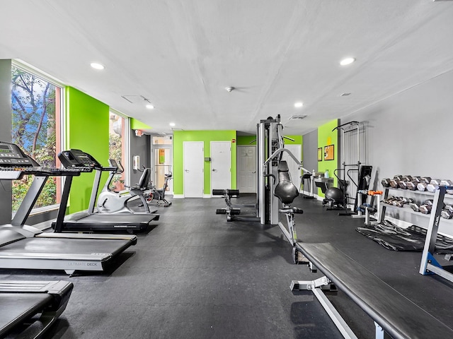 gym with baseboards and recessed lighting
