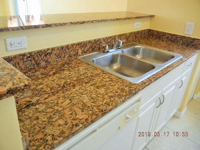 details with white dishwasher, a sink, and white cabinets