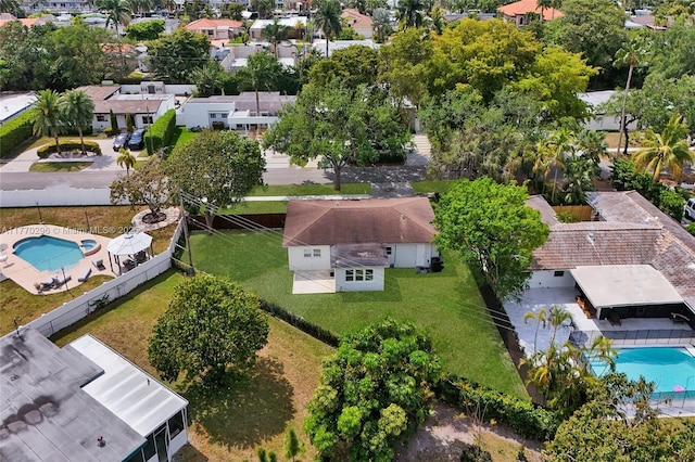 birds eye view of property with a residential view
