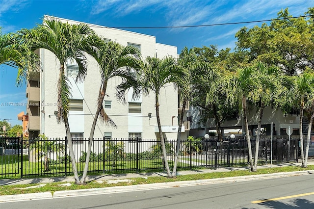 view of property featuring fence