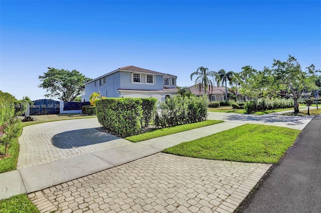 721 Ranch Rd, Weston, FL 33326 - view of front of property with decorative driveway, a gate, and stucco siding