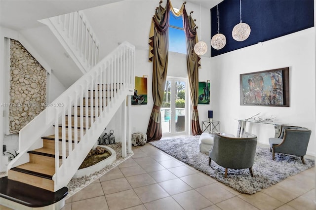721 Ranch Rd, Weston, FL 33326 - tiled living room with high vaulted ceiling and stairs