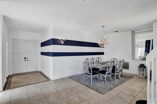 721 Ranch Rd, Weston, FL 33326 - dining room with a chandelier and light tile patterned floors