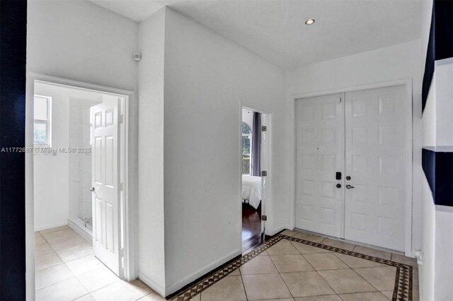 721 Ranch Rd, Weston, FL 33326 - entrance foyer featuring light tile patterned floors and baseboards
