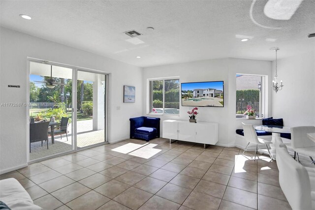 721 Ranch Rd, Weston, FL 33326 - tiled living room featuring a textured ceiling, a chandelier, and recessed lighting