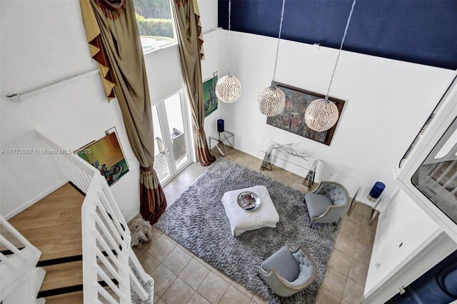 721 Ranch Rd, Weston, FL 33326 - tiled living area featuring a towering ceiling