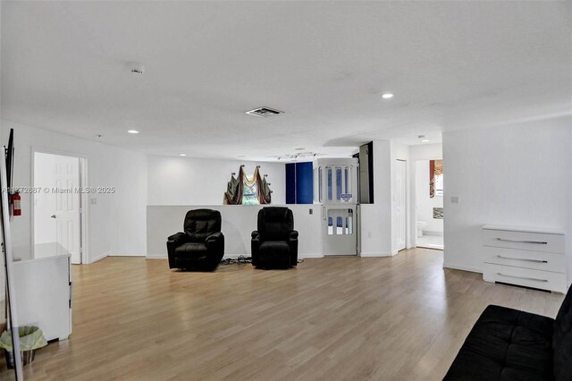 721 Ranch Rd, Weston, FL 33326 - sitting room with light wood-type flooring and recessed lighting