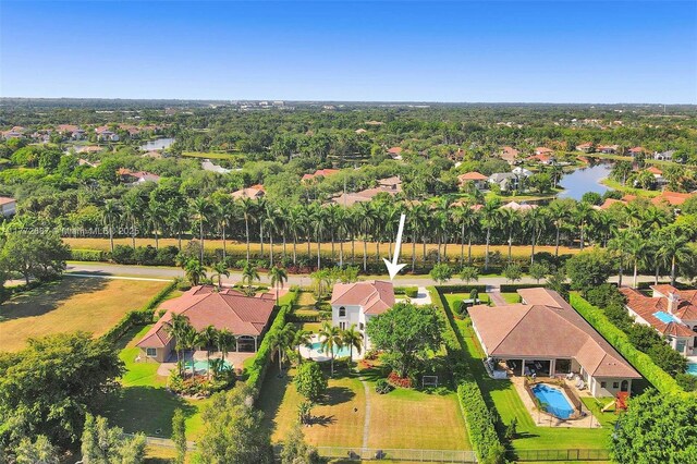 721 Ranch Rd, Weston, FL 33326 - aerial perspective of suburban area featuring a pool area and a nearby body of water