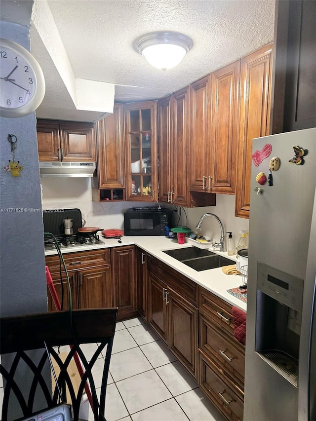 1300 W 47th Pl Unit 217B, Hialeah, FL 33012 - kitchen with stainless steel appliances, a textured ceiling, light countertops, and a sink
