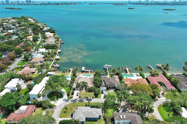 drone / aerial view with a water view and a residential view