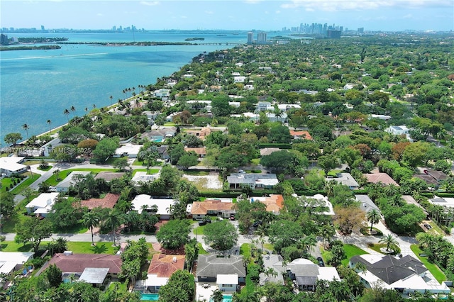 aerial view featuring a water view, a view of city, and a residential view