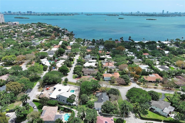 bird's eye view featuring a water view and a view of city