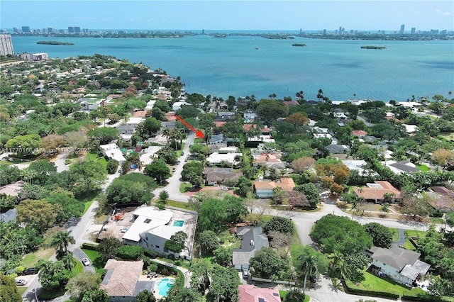 drone / aerial view with a view of city and a water view