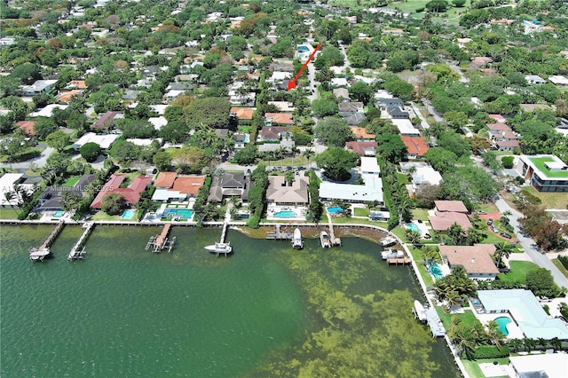 drone / aerial view with a residential view and a water view