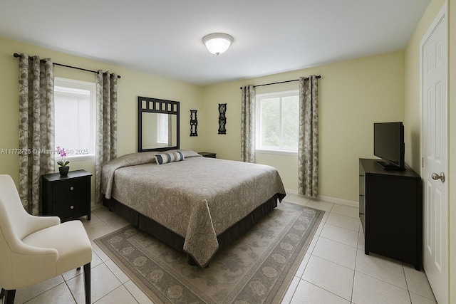 6133 SW 62nd Ter, South Miami, FL 33143 - bedroom featuring light tile patterned floors and baseboards