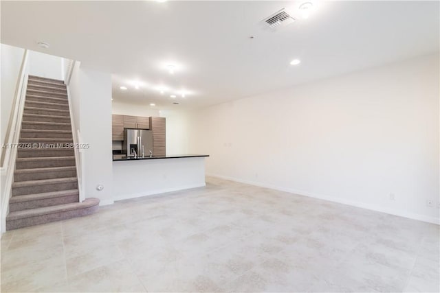 2664 SW 81st Ter Unit 2666, Miramar, FL 33025 - unfurnished living room featuring stairs, recessed lighting, and light tile patterned floors